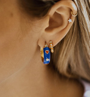 Single orange twirl ring earring goldplated